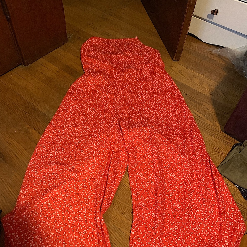Target jumpsuit with spaghetti straps. Red with floral pattern, never been worn.